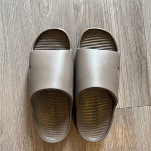 Nike Calm Slides in Mink Brown